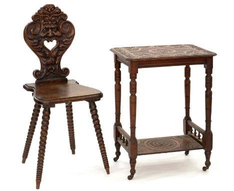 A VICTORIAN CARVED MAHOGANY SIDE TABLE ON TURNED LEGS AND POTTERY CASTORS, 72CM H AND A 19TH C GROTESQUE CARVED OAK HALL CHAI