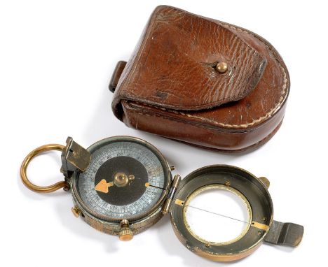 A BLACKENED BRASS PRISMATIC COMPASS, 8.5CM INCLUDING SUSPENSION RING, IN LEATHER CASE, C1900 