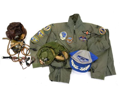 A WORLD WAR II LEATHER FLYING HELMET AND A MENS SUMMER TYPE 1 CLASS 1 CWU 27/P MIL-C-B3141A (USAF) FLYING SUIT, ETC 