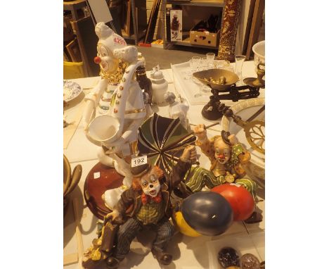 Two cast resin clown figurines and a large ceramic clown