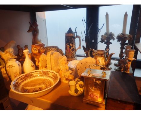 Shelf of assorted items including clock, stein, wooden box, book ends etc