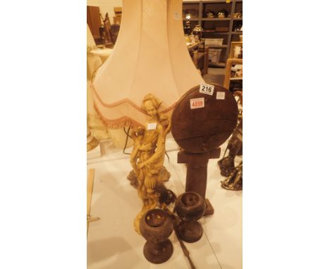 Selection of African and Oriental ornaments and a table lamp