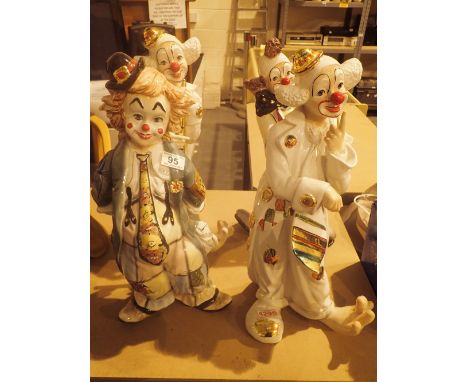 Four large ceramic clown figurines
