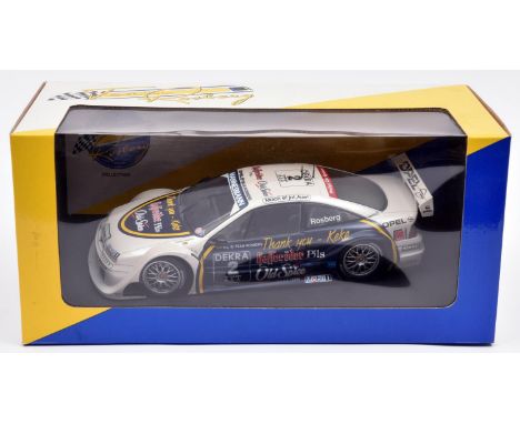 UT Models/Minichamps 1:18 scale Opel Calibra V6 Racing Car. An example in 'Team Rosberg' white, dark blue and yellow livery, 