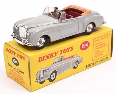 Dinky Toys Bentley Coupe (194). In light grey with maroon interior with fawn tonneau, complete with  driver. Plated dished sp