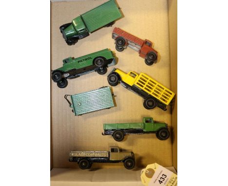 7x Dinky Toys. 25 series; A Wagon (25a) in light green. Petrol Tank Wagon (25d) in green. Tipping Wagon (25e) in stone. Marke