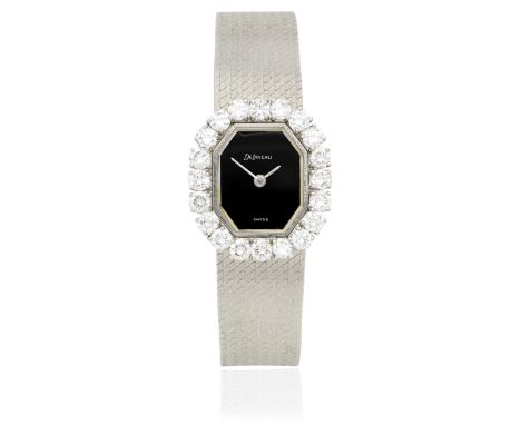 Delaneau. A lady's 18K white gold diamond set manual wind watch with onyx dialDate: Circa 1970Movement: Jewelled Cal.59B manu