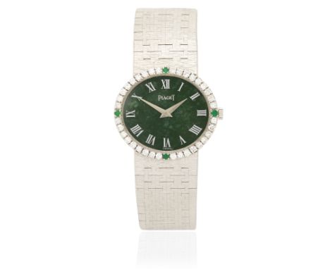 Piaget. A lady's 18K white gold diamond and emerald set manual wind bracelet watch with malachite dialReference: 9806 B25Date