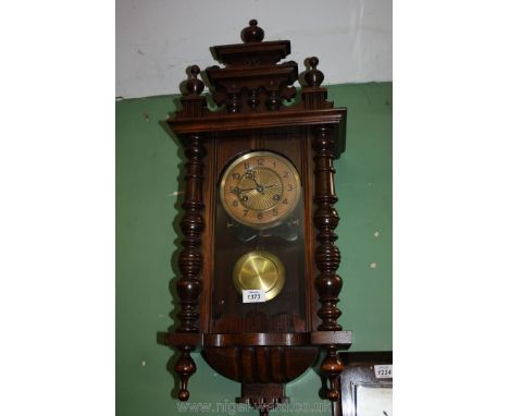 An eight day Wall Clock with turned details