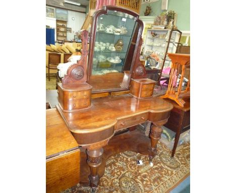 An attractive early 20th c. Duchess style Dressing Table having a central frieze drawer and a shaped mirror supported on a pa