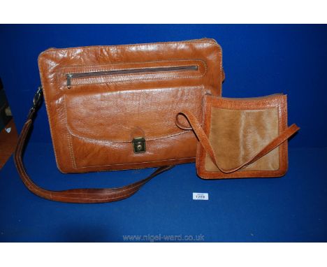 Two vintage leather bags, one a large man bag.
