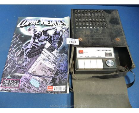 A vintage ''Marconiphone'' cassette tape recorder and a "Comic Heroes Bad Girls Issue" glossy magazine.