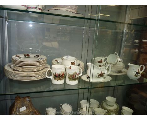A quantity of hunting scene china including large charger, dinner plates, side plates, gravy boat, four cups and saucers and 