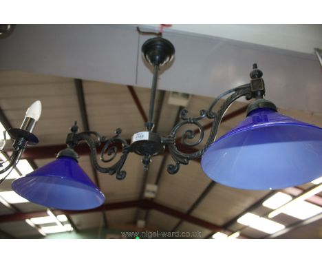 A twin hanging Light with blue glass shades.