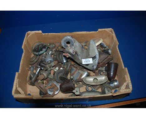 A box of vintage car parts including ash trays, bonnet catches, petrol caps etc.