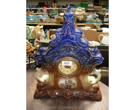 A large china Clock depicting two farm girls.