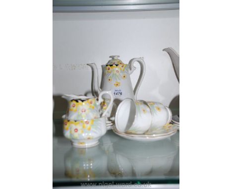 A part Royal Albert Crown China Daffodil with black highlights pattern Coffee Service, to include four cups and saucers, milk