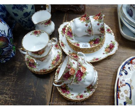 A Royal Albert 'Old Country Roses' part Teaset consisting of six cups and saucers, six side plates, milk jug and bread and bu