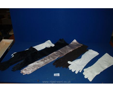A box containing four pairs of vintage long-arm 1930's dance Gloves in silk/cotton in black, white, cream and three pairs of 