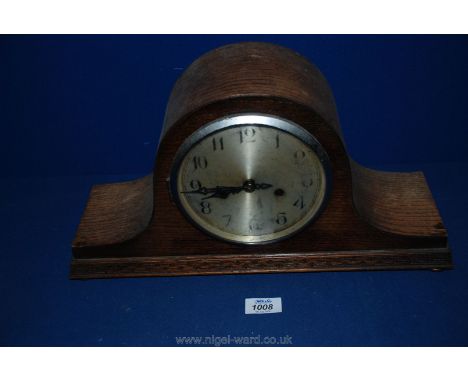 A wooden cased Mantle Clock.