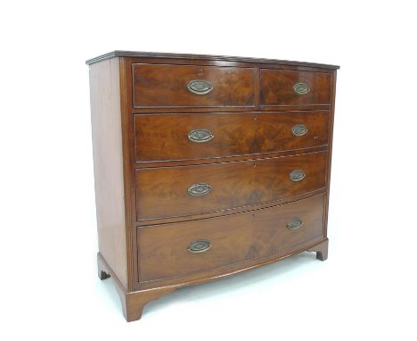 An early Victorian figured mahogany bow fronted chest of drawers, two short over three long graduating drawers with brass pla