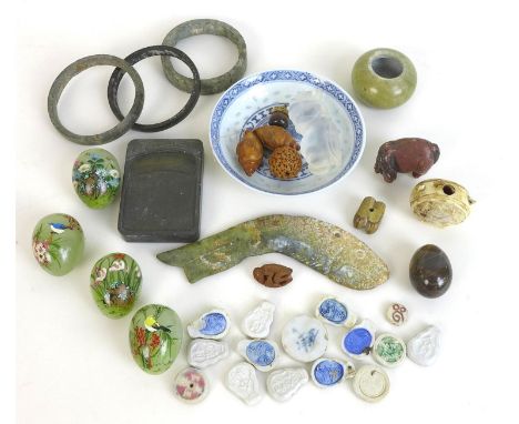 A group of eight Chinese jade items and other oriental collectables, three jade hoops, a carved jade fish four 20th century p