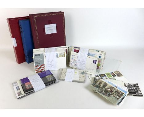 A collection of stamps, postcards and first day covers, with seven albums of International stamps, two albums of Animal and b