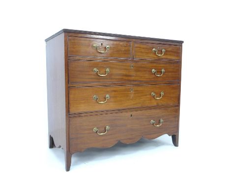 A late George III mahogany chest of drawers, the two short over three long graduating drawers with brass swan neck handles an