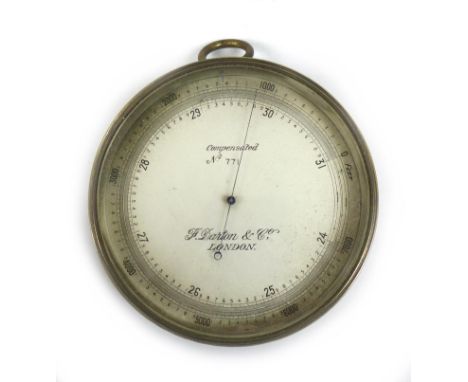 A WWI brass aneroid barometer, by F. Darton & Co, London, of circular form with silvered dial and brass ring suspension hook,