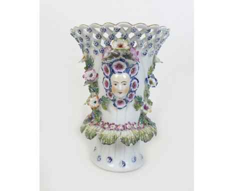 A Bow soft paste porcelain frill vase, circa 1760, of flared cylindrical form with incised body, pierced lattice upper body i