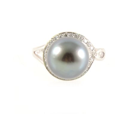 A Tahitian pearl and diamond ring, the 12mm pearl peg set and encircled by twenty-six brilliant cut diamonds in a 14 carat wh