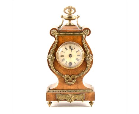 A French Empire style stained walnut and gilt metal mantel clock, Lenzkirch cylinder movement, No.387306, case with an urn fi
