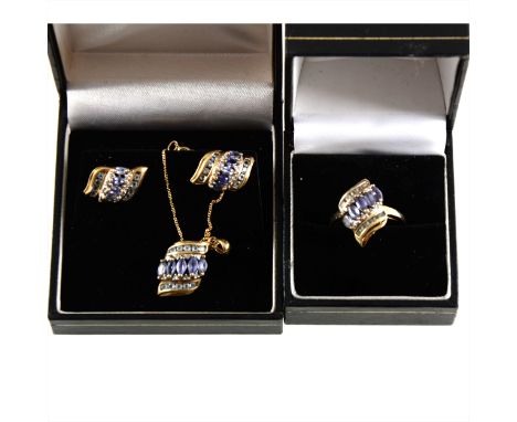 A suite of tanzanite jewellery, a ring, pair of earstuds for pierced ears and a pendant and chain with each piece set with fi