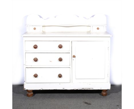 A painted pine Lincolnshire dresser, serpentine shelf over with two drawers, the base with three drawers and a cupboard, widt