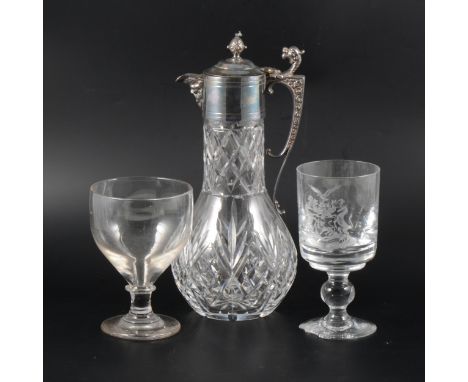 An electroplated claret jug, Bacchus mask, dragon-topped handle, and fruit finial, 30cm, plus two rummers. (Qty: 3)
