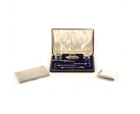 A silver cigarette case, Frederick Field Ltd, Birmingham 1938, engine turned, 14cm x 8.5cm, a smaller cigarette case, and a s