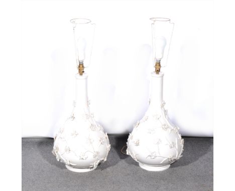 A pair of stoneware lamp bases, floral encrusted, 52cm; five other lamps, and a vase. (8)