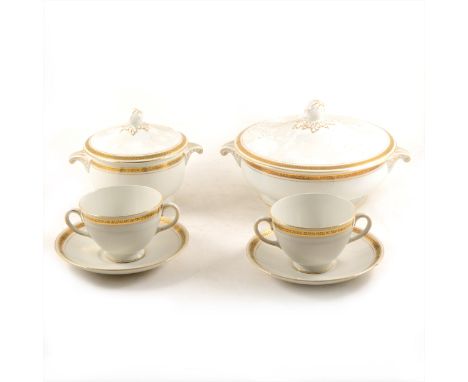 A Cauldon bone china dinner service, Greek key pattern outlines, including tureens, meat plates, dinner plates, dessert plate