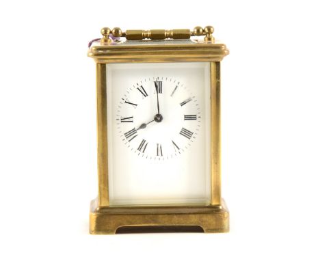 A French brass cased carriage clock, white enamelled dial, platform escapement, non-striking, 12cm.