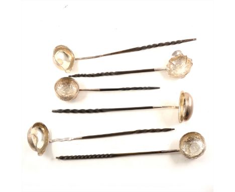 George II punch ladle, indistinct maker's mark, London 1752, repaired handle, 31cm; and five white metal ladles, each with tw