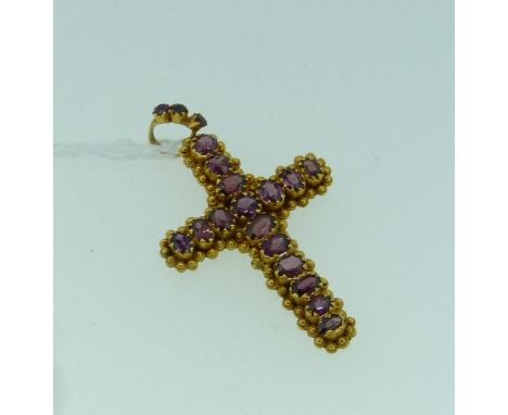 An attractive amethyst set Cross Pendant, set with sixteen facetted amethysts surrounded by ball and ropework borders, suspen