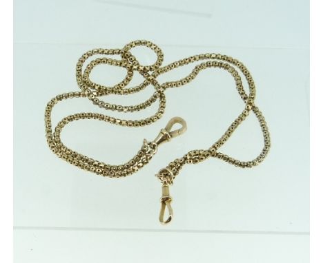 A 9ct yellow gold Watch Chain, worn as a necklace, formed of a double row of hollow links, each facet pierced, with a suspens