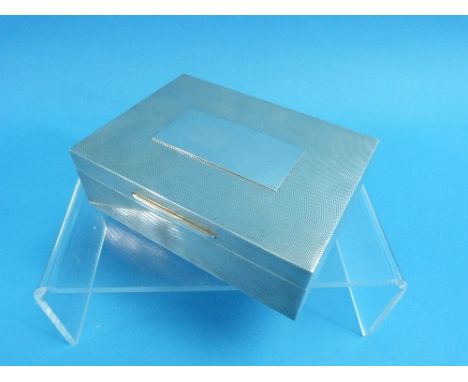 A silver Cigarette Box, by Asprey &amp; Co. Ltd., hallmarked London 1965, of hinged rectangular form, with engine turned deco