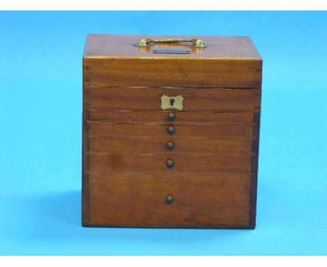 An Early 20thC mahogany Dentist's Table Top Instrument Chest, with folding top handle and hinged lid revealing a shallow comp