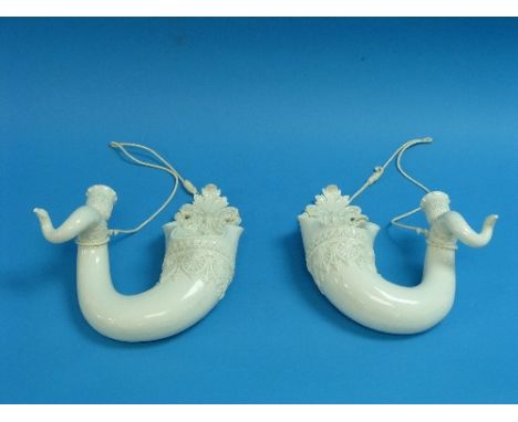 A pair of Royal Worcester white porcelain horn-shaped Wall Vases, each of leaf-capped scroll form with candle holder, moulded