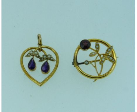 A 9ct yellow gold heart shaped open Pendant,  the centre with two amethyst drops, with seed pearl set leaves above, with susp