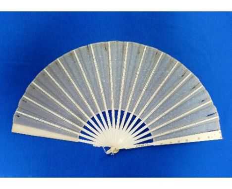 A late 19thC French sequined gauze Fan, with sixteen sticks and two guard sticks formed of bone, alternately carved in light 