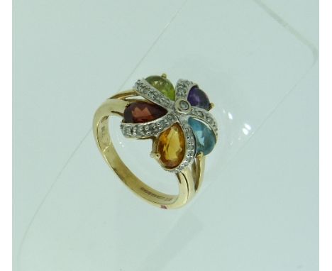 A harlequin gem set flowerhead Ring, with small diamond point centre and with five separate lines set four diamond points, ea