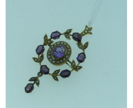 An attractive open circular Pendant, the centre set with oval amethyst surrounded by seed pearls, the outer circle with six a