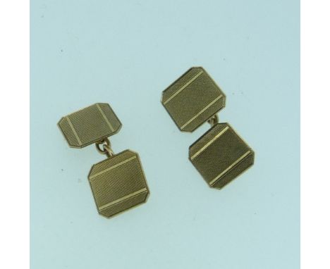 A pair of 9ct yellow gold double sided Cufflinks, each of square chamfered corner shape, with engine turning, chain between, 